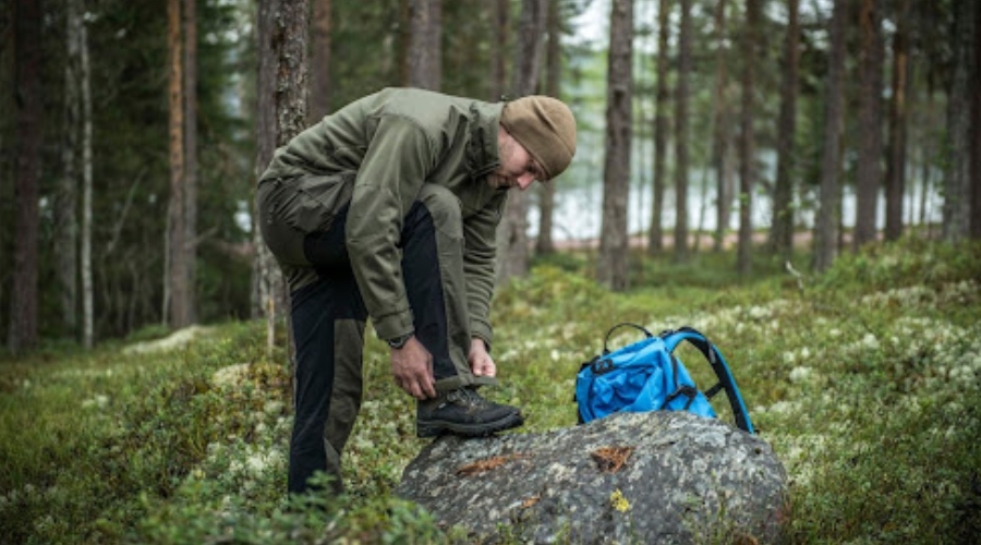Man with a backpack and outdoor clothing. 